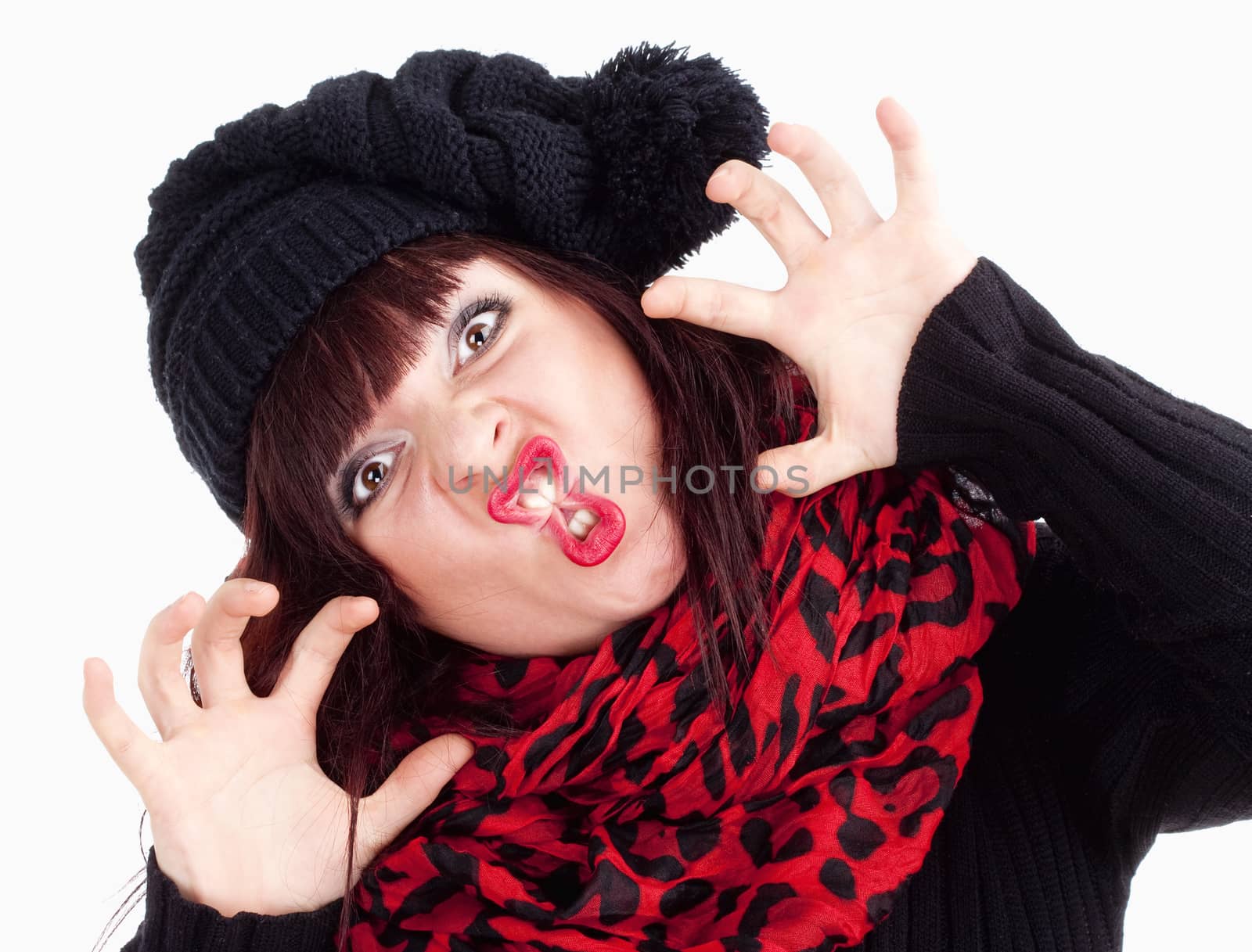 Young Woman in Cap Posing Hands as Claws - Isolated on White