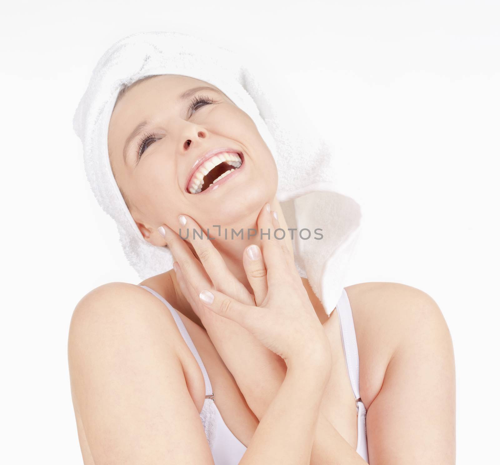 Beautiful Young Woman with Towel on her Head Smiling - Isolated on White