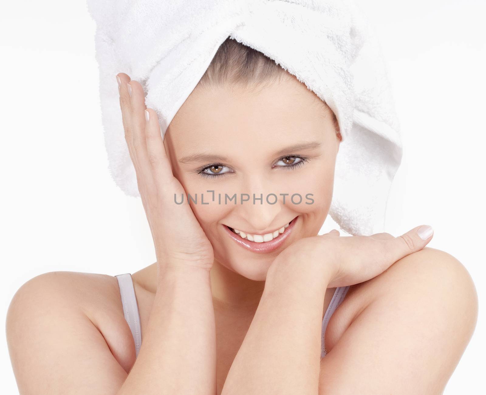 Beautiful Young Woman with Towel on her Head Smiling - Isolated on White