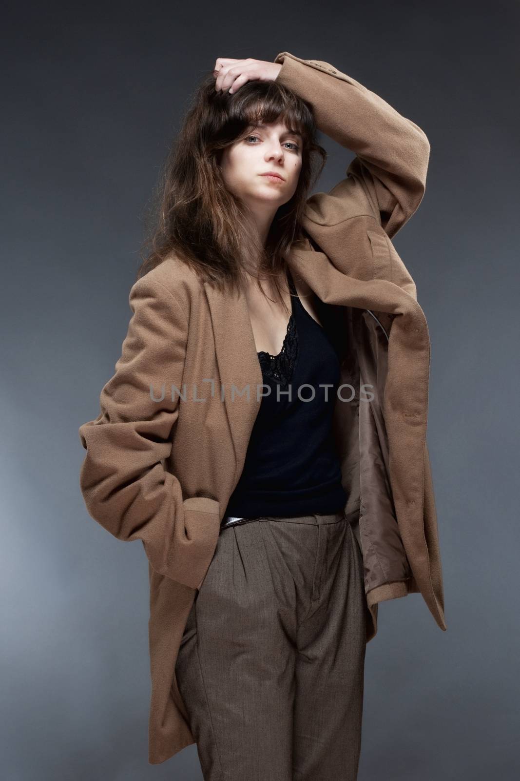 Portrait of a Young Woman in Brown Coat