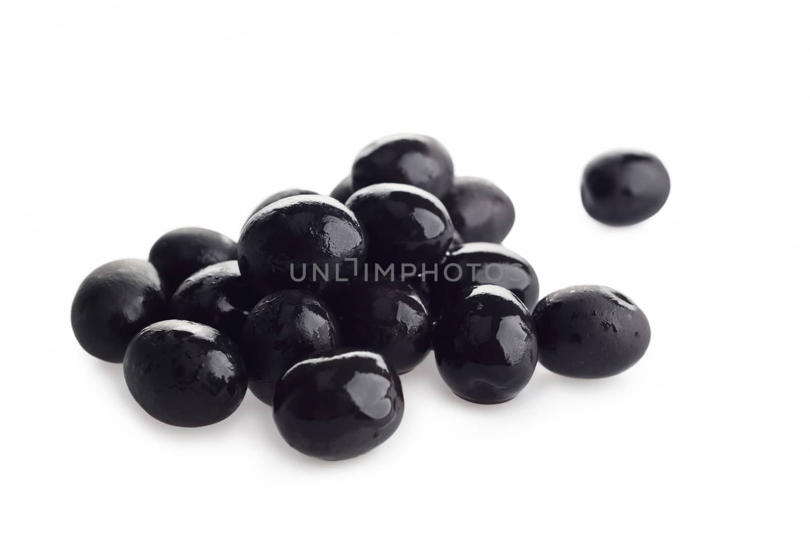 Black olives isolated on white background.