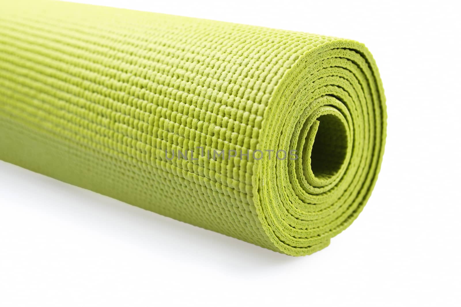 Green exercise mat isolated on white background. 