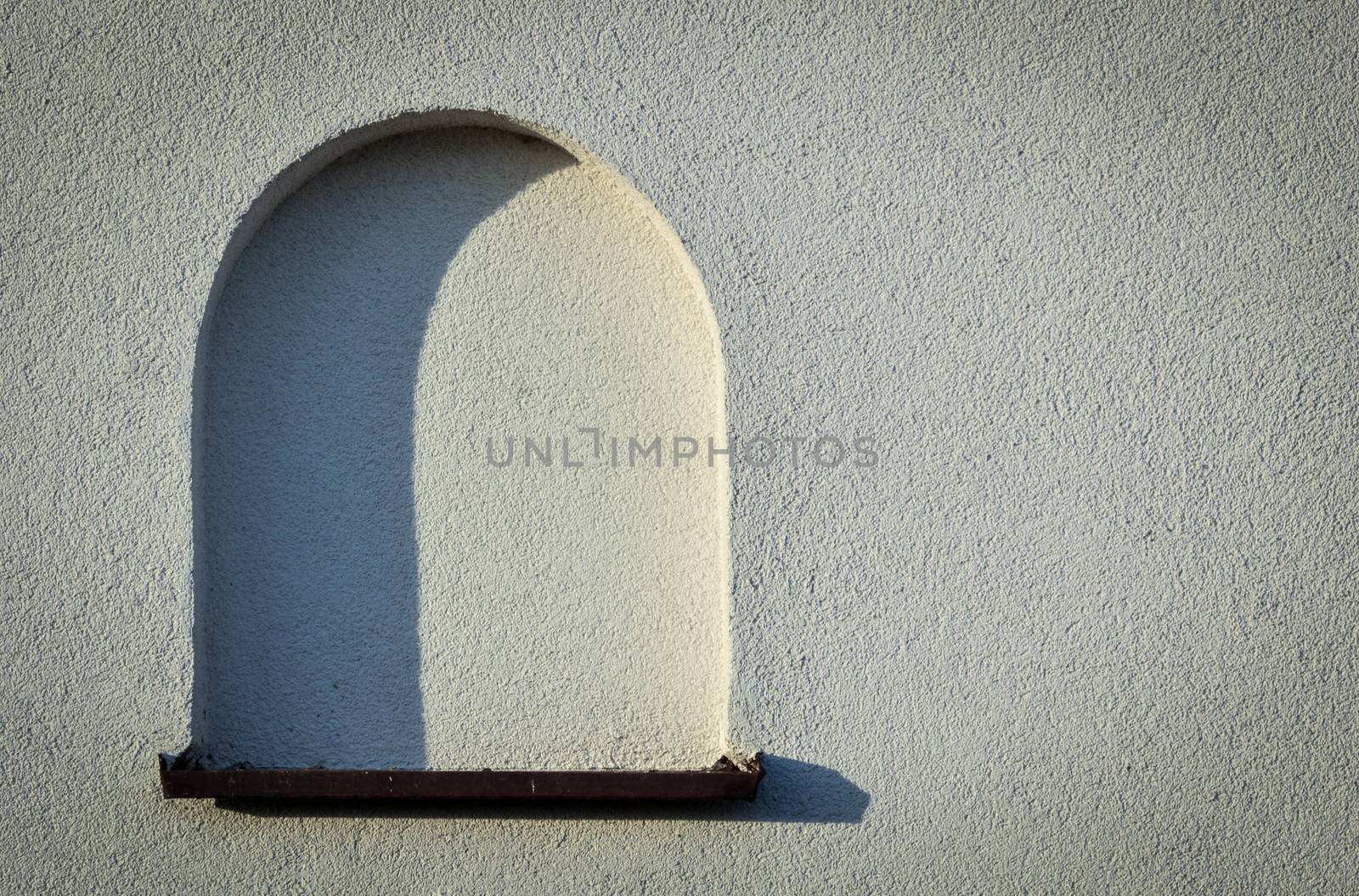 background or texture blank arched window on the light wall
