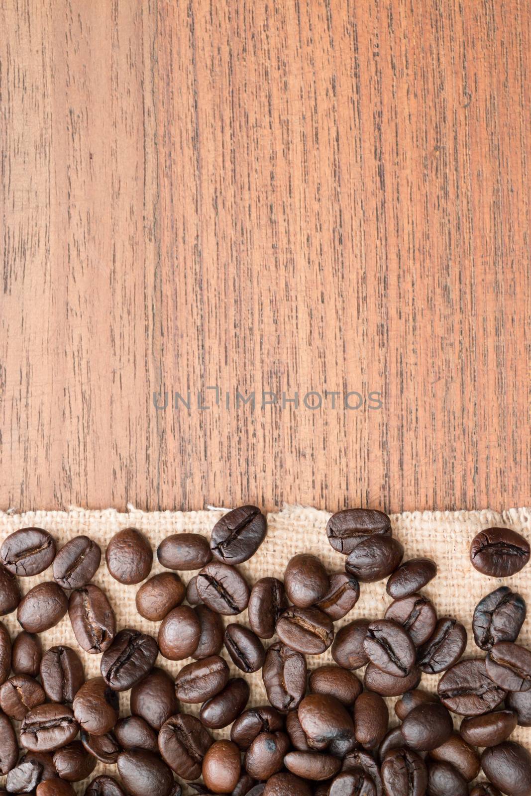 coffee beans on teak wooden table