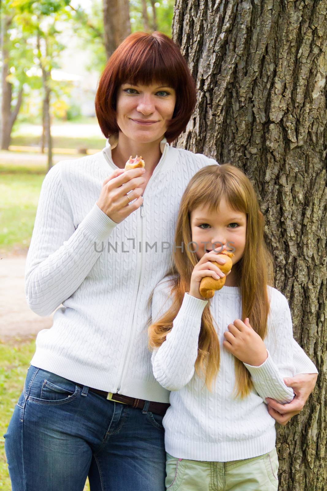 Photo of mother and daughter are eating