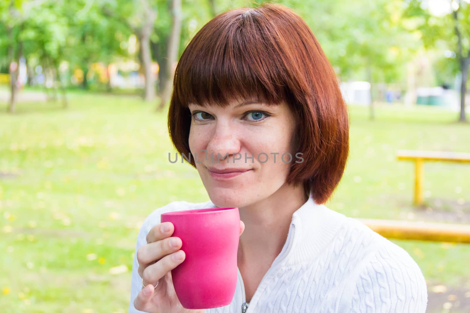 Photo of woman with brown hair drinking tea