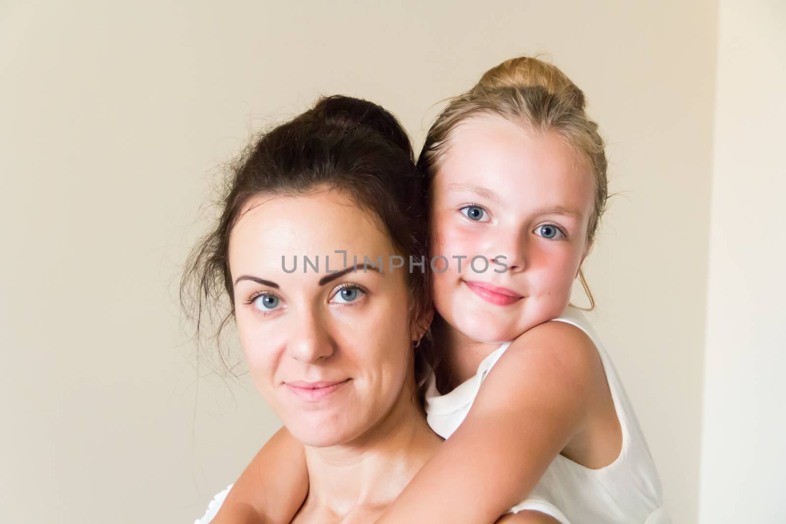 Photo of mother and daughter in white