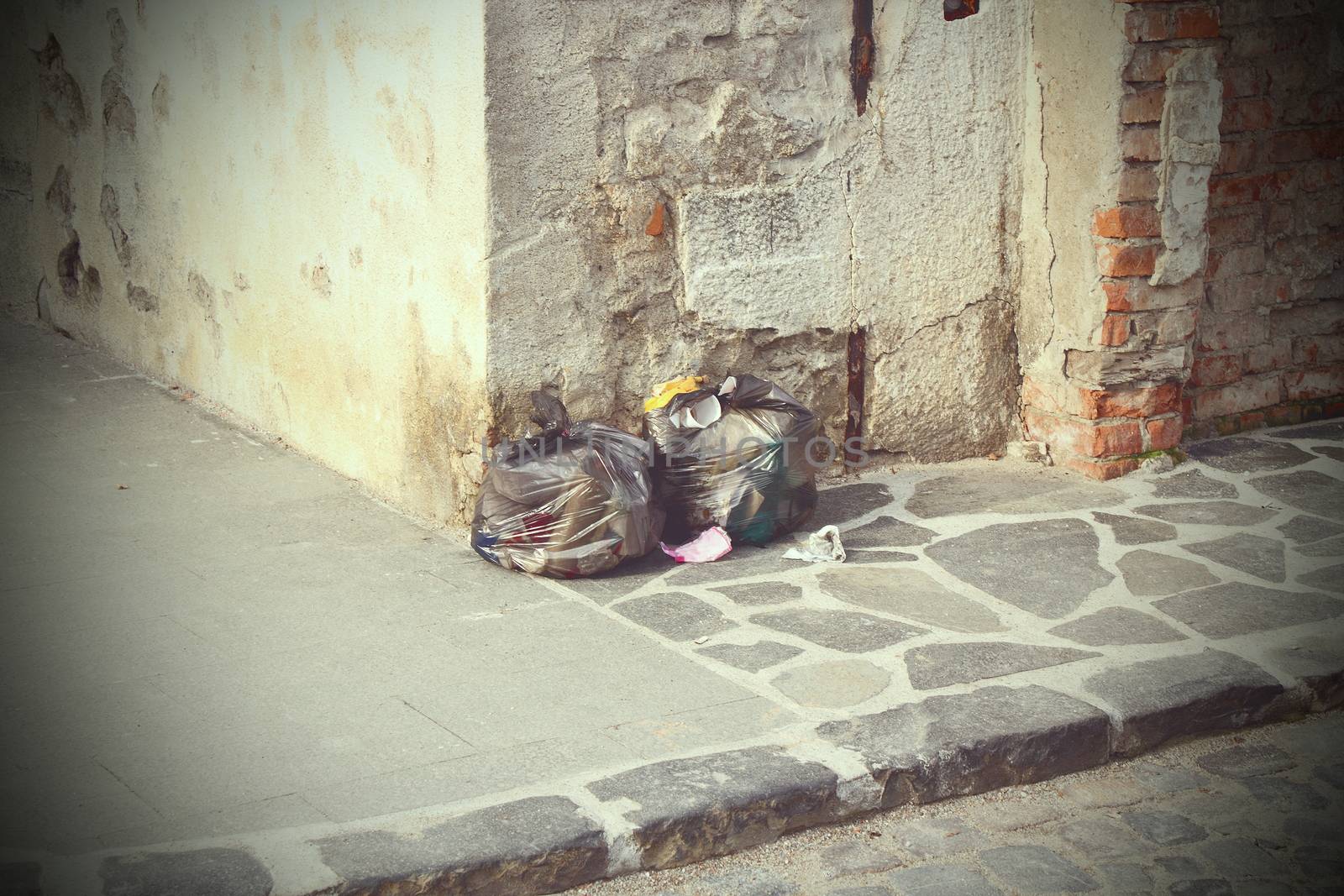 garbage left on the street, vintage look with vignette