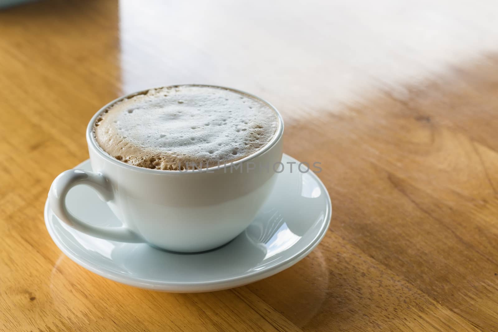 coffee cup on wood background
