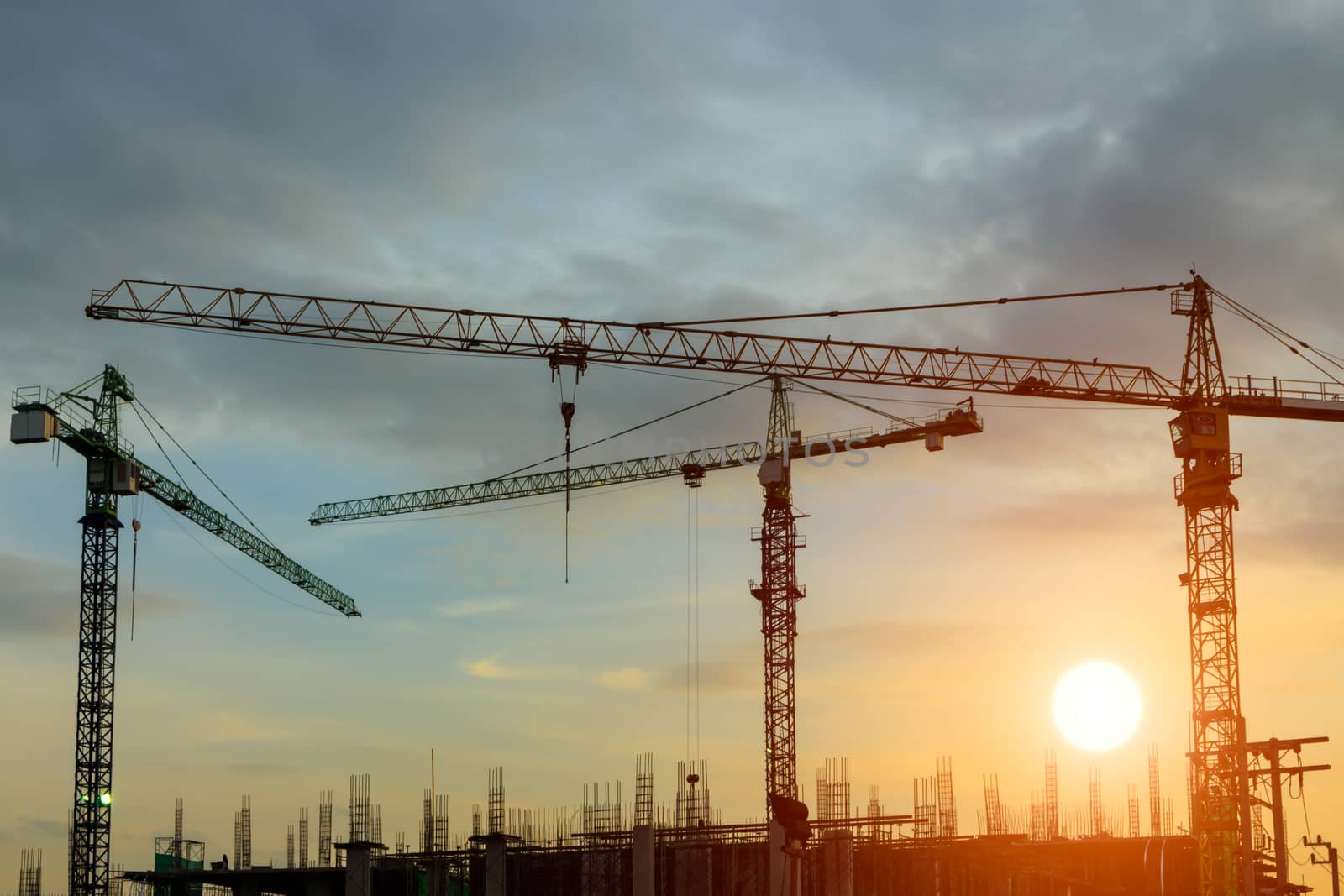 construction crane on sunset by blackzheep