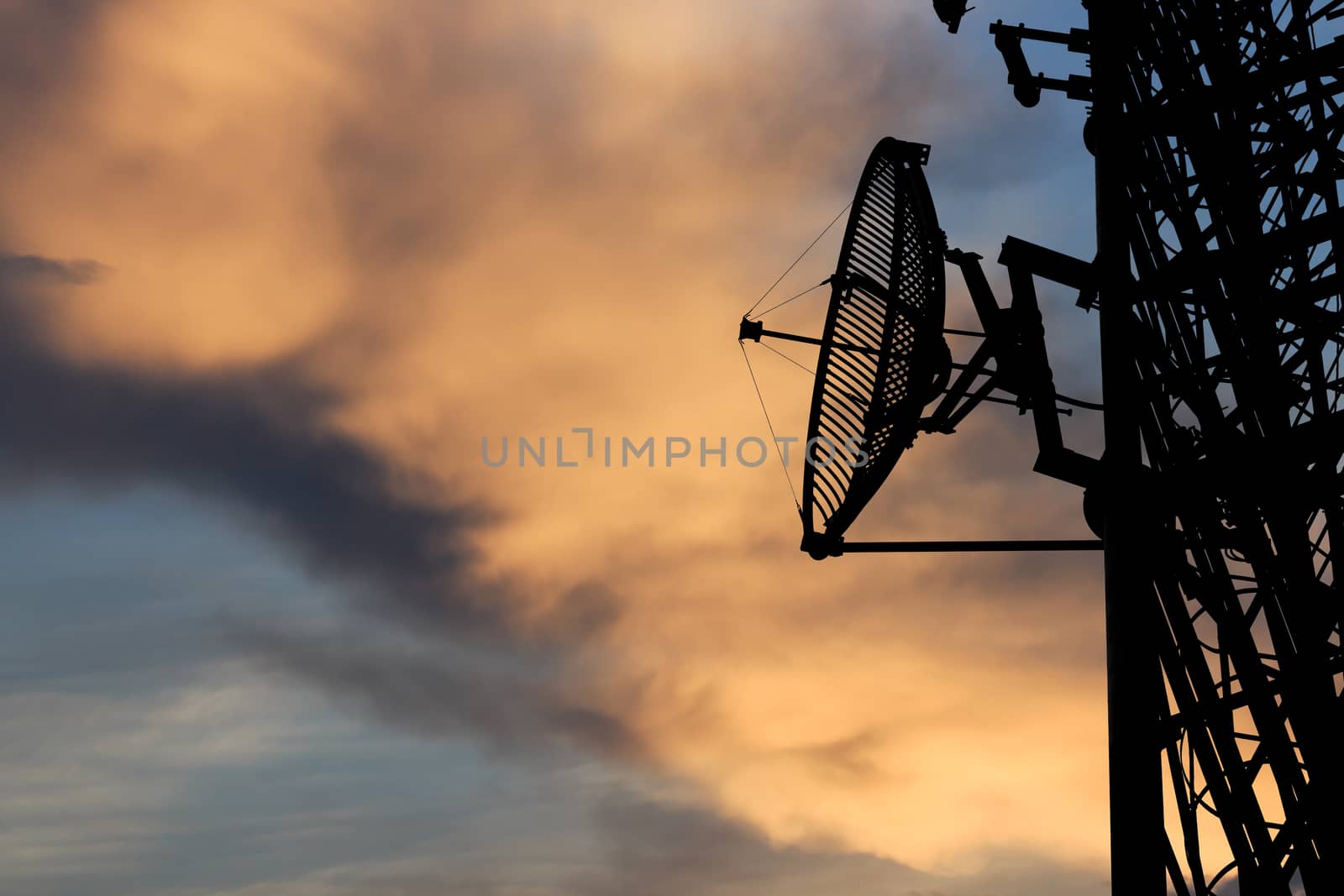 silhouette satellite communication tower poles on sunset by blackzheep