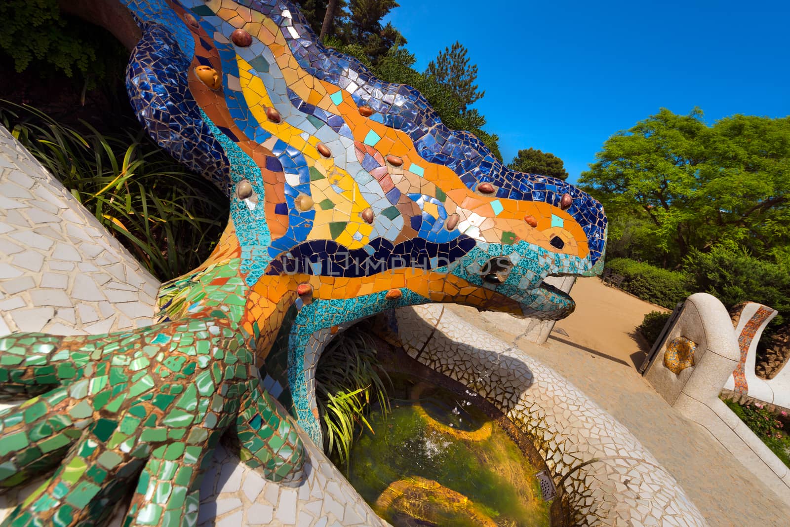 BARCELONA, SPAIN - JUNE 10, 2014: The famous salamander with mosaic in the Park Guell designed by the famous architect Antoni Gaudi (1852-1926). UNESCO, World Heritage Site