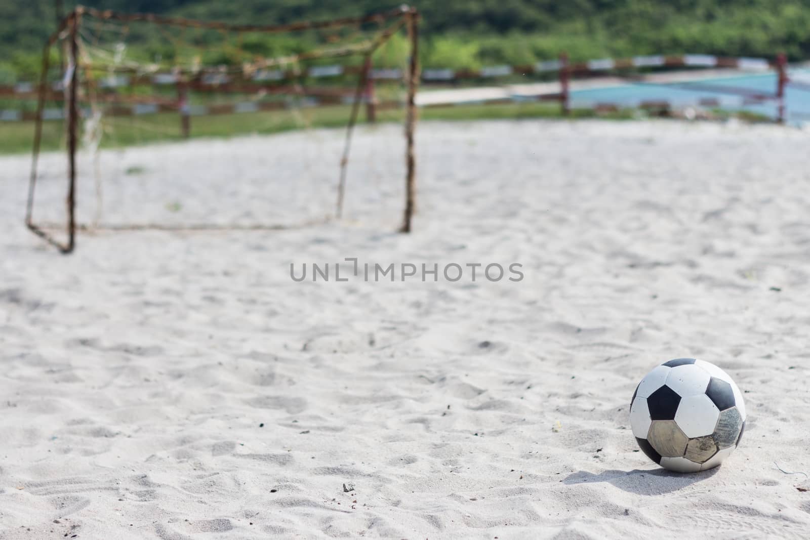 football on the white beach