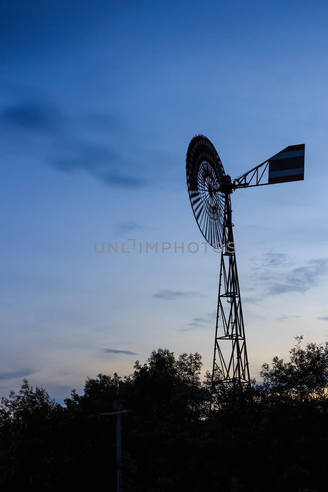 old windmill on sunset by blackzheep