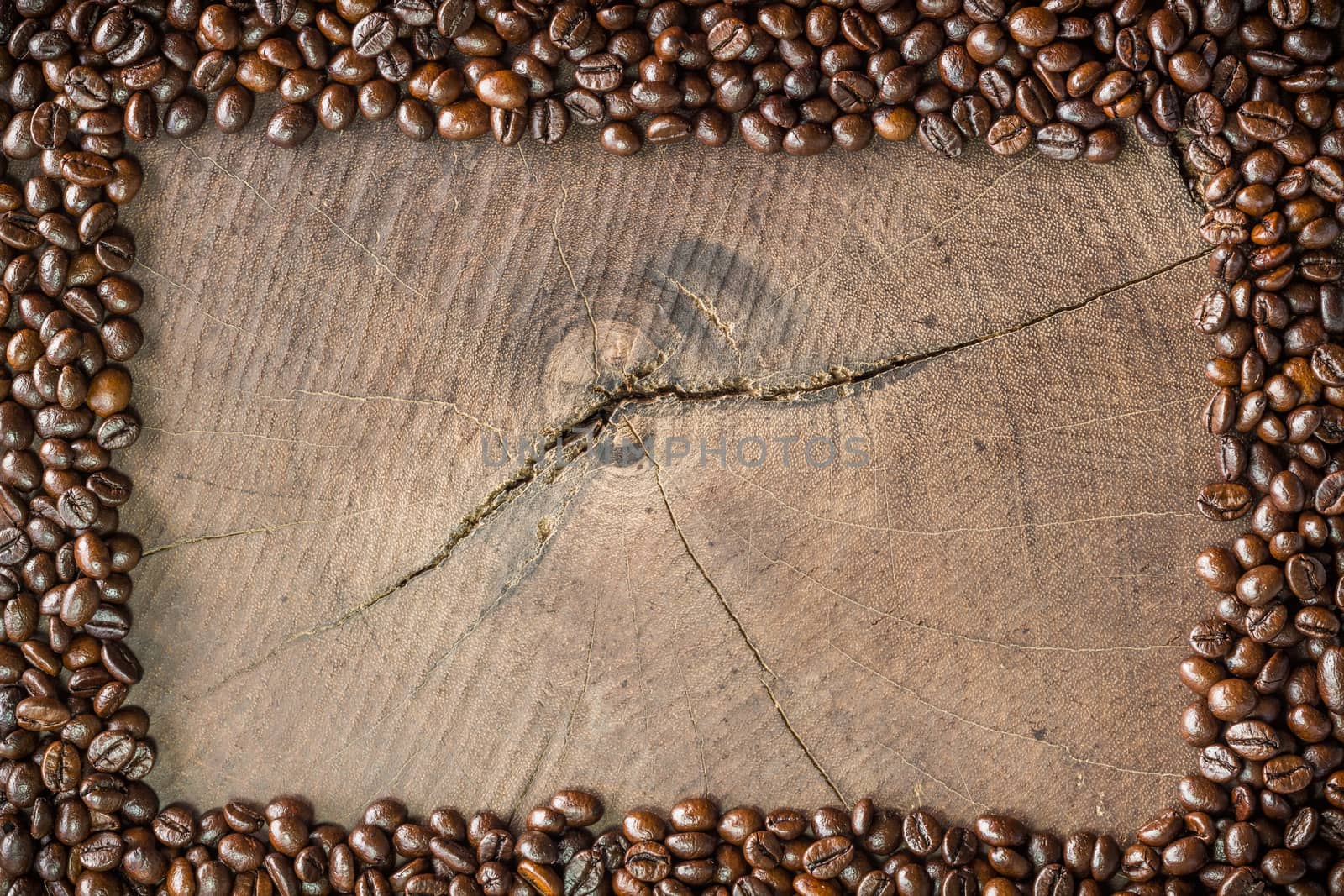frame of coffee beans on stump background