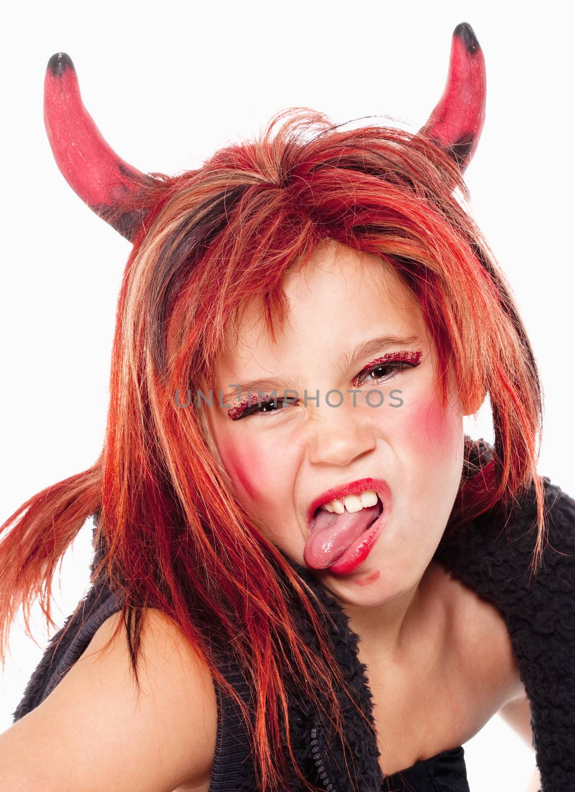 Portrait of a Young Girl in Wig Posing as a Devil