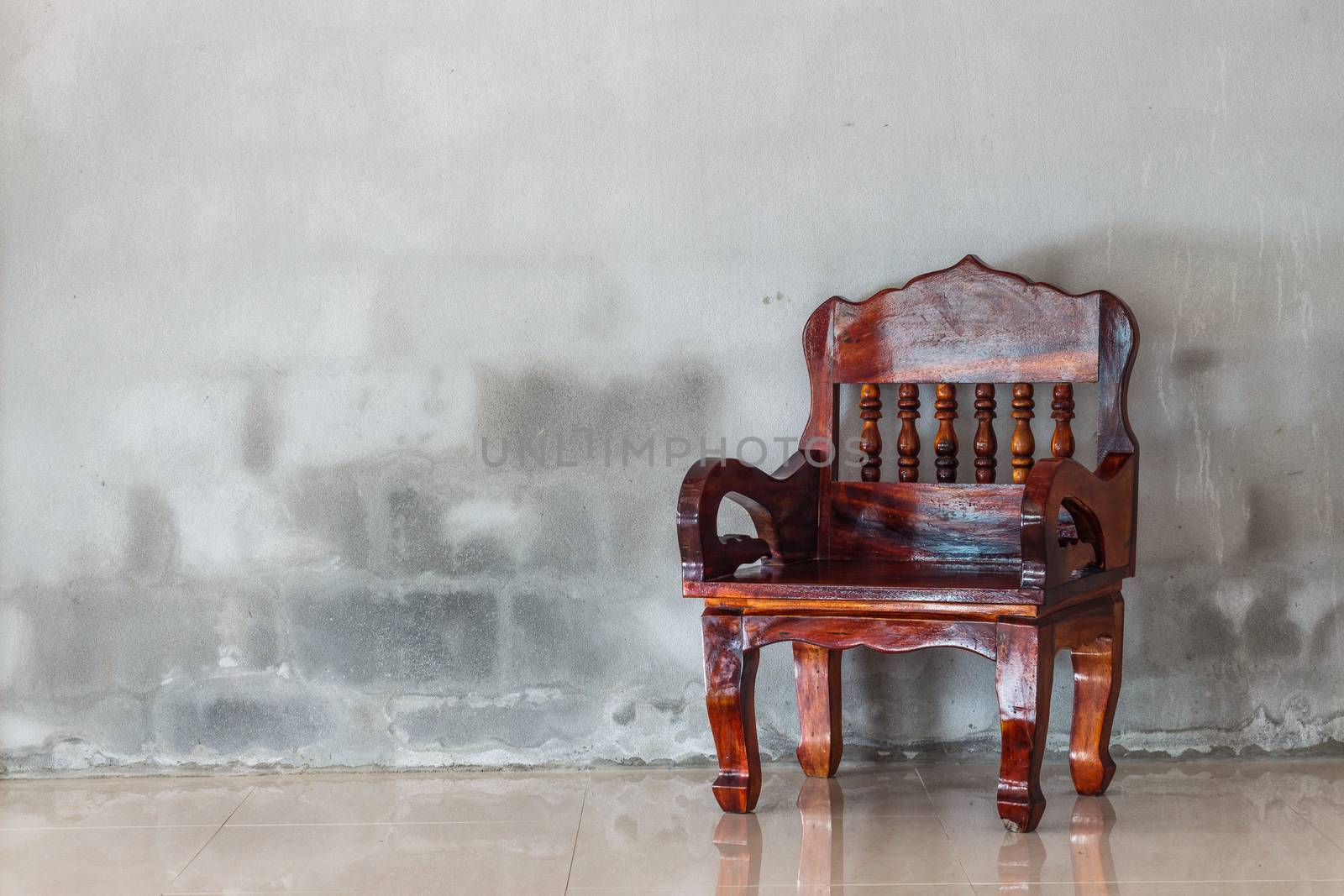 wood chair furniture and grunge concrete wall background