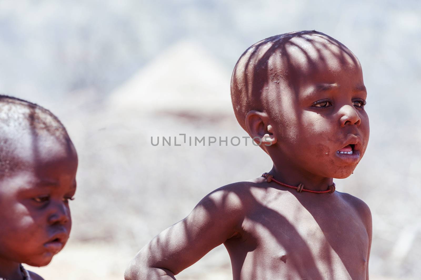 NAMIBIA, KAMANJAB, OCTOBER 10: Unidentified child Himba tribe. The Himba are indigenous peoples living in northern Namibia, in the Kunene region of South-West Africa on october 10 2014