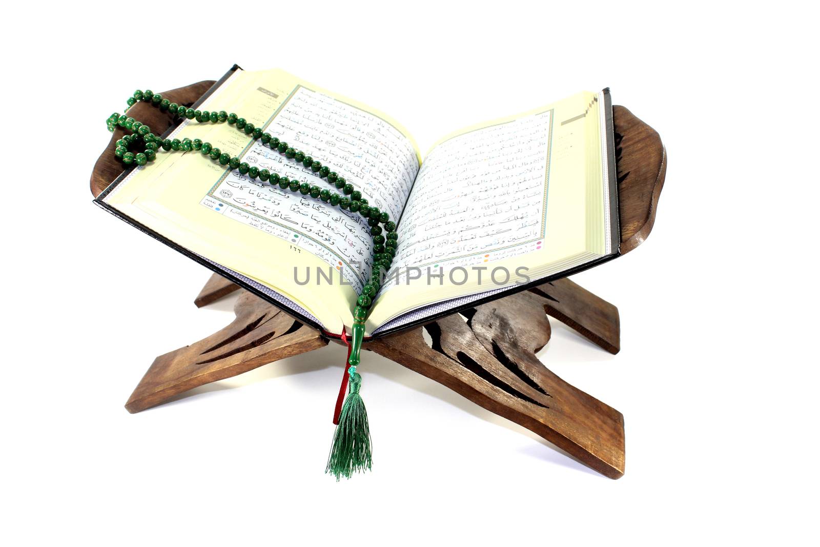 stand with an opened Quran and rosary by discovery