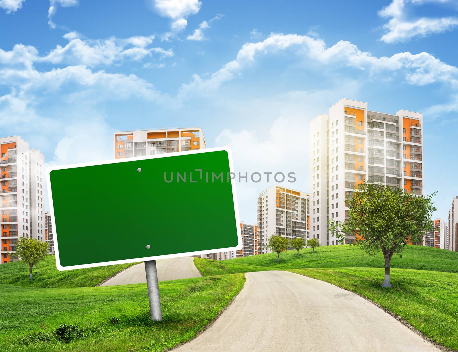 Buildings, green hills and road with empty roadsign against sky by cherezoff