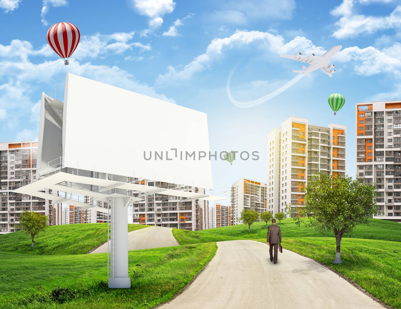 Businessman walks on road. Rear view. Buildings, grass field, large billboard and sky in background by cherezoff