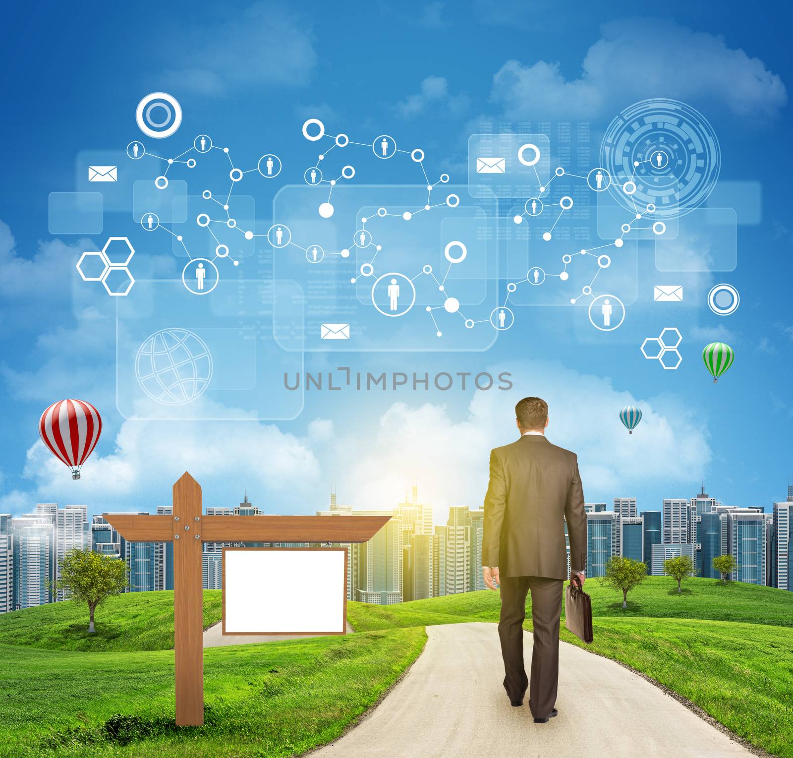 Businessman walks on road. Rear view. Buildings, grass field, wooden signboard and sky with virtual elements. Business concept