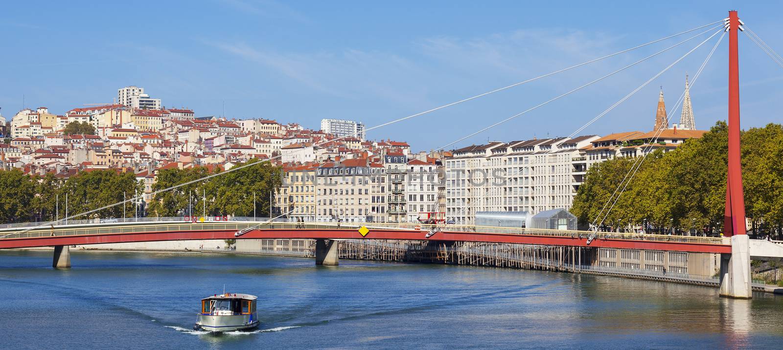 Panoramic view on Lyon and Saone river with boat, France