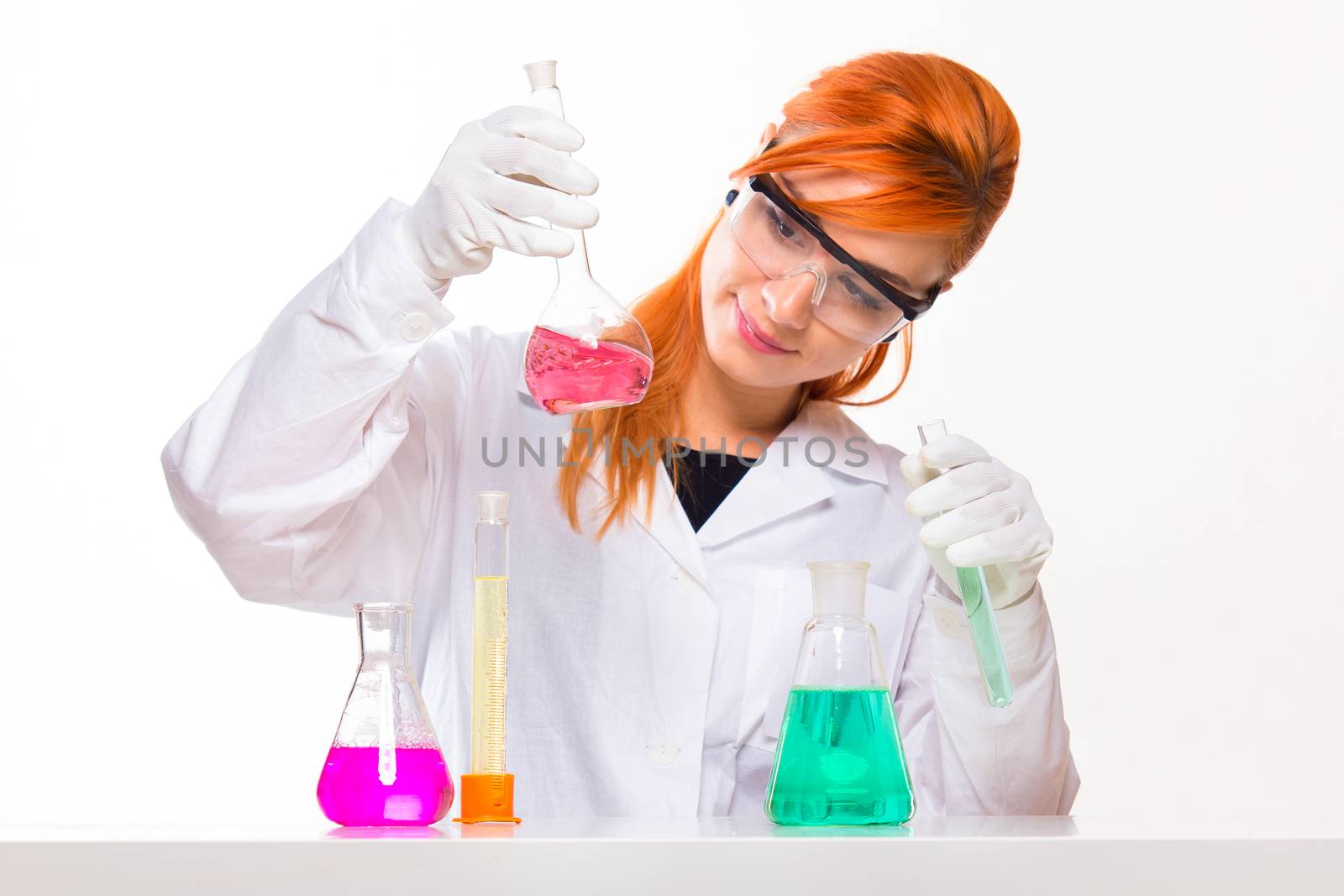 Chemist looks at the glass in the lab - studio shoot 