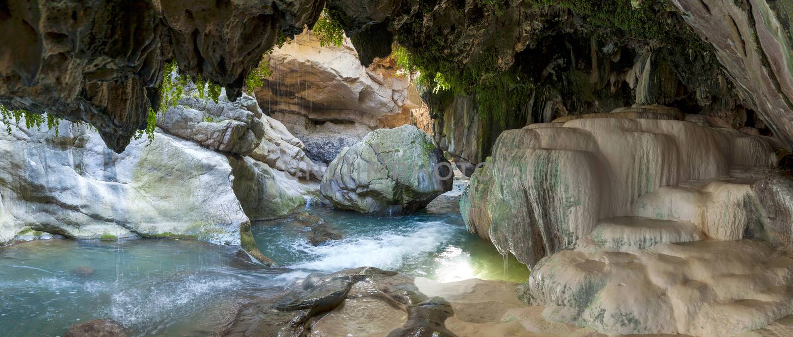 bowls of a mineral source in a grotto at the bottom of the Vorotansky gorge