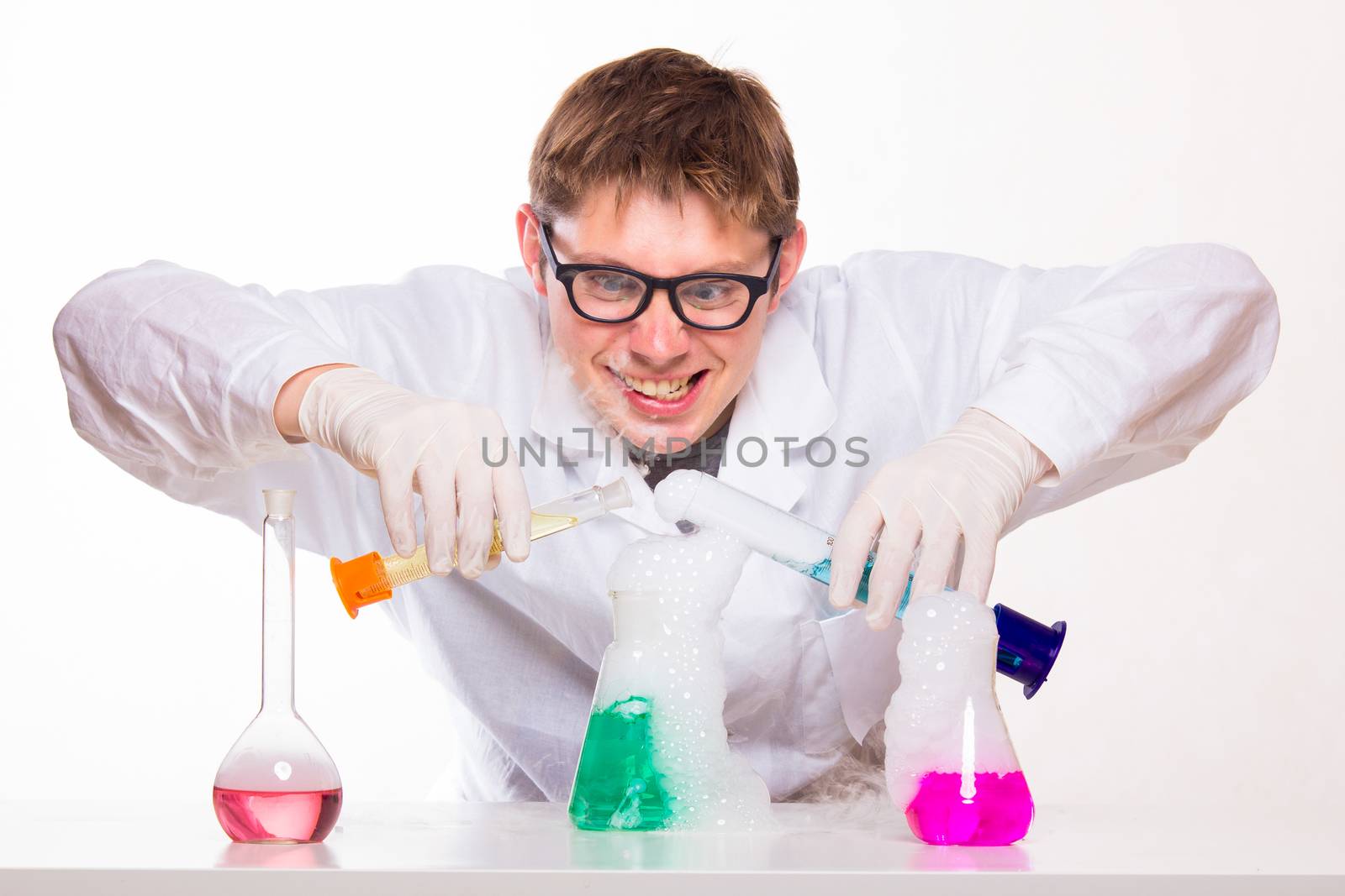 mad chemist in the lab doing reaction - studio shoot
