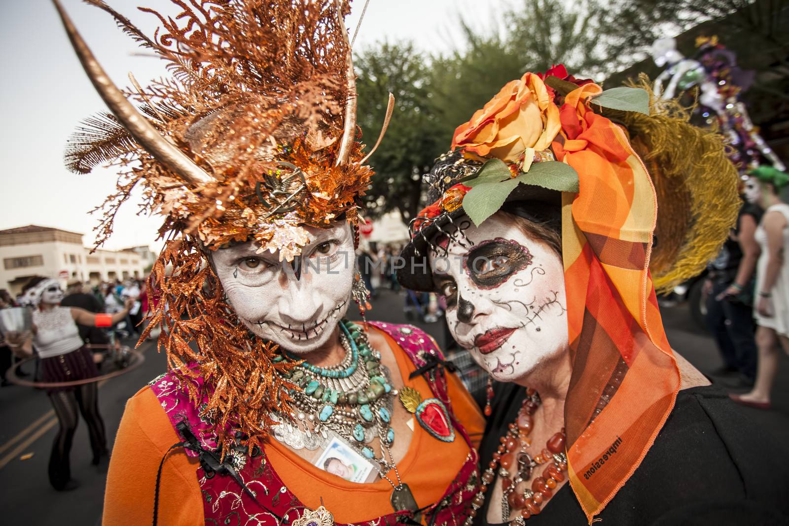 Women in Dramatic Dia De Los Muertos Makeup by Creatista