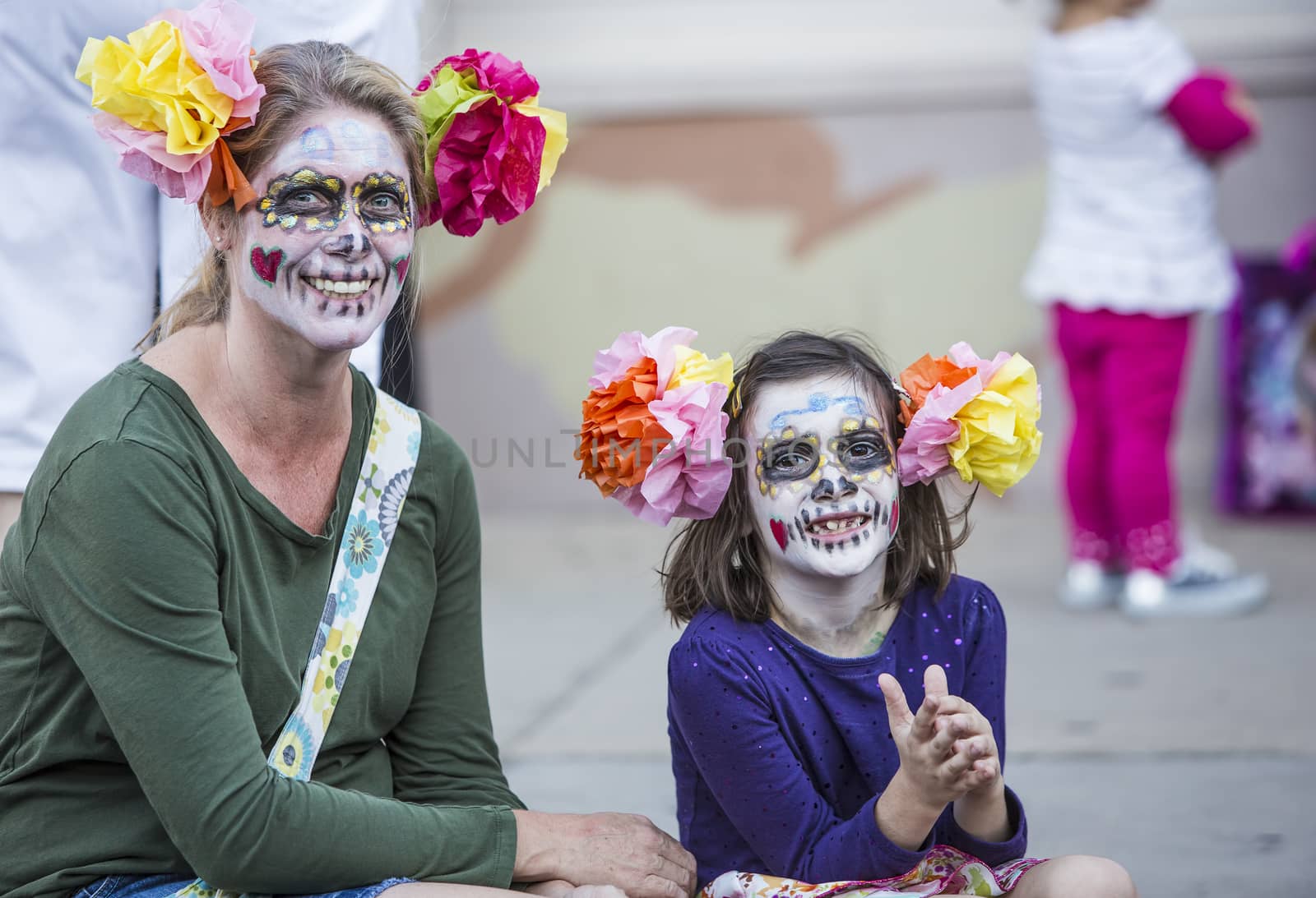 TUCSON, AZ/USA - NOVEMBER 09: Unidentified woman and girl in facepaint at the All Souls Procession on November 09, 2014 in Tucson, AZ, USA.