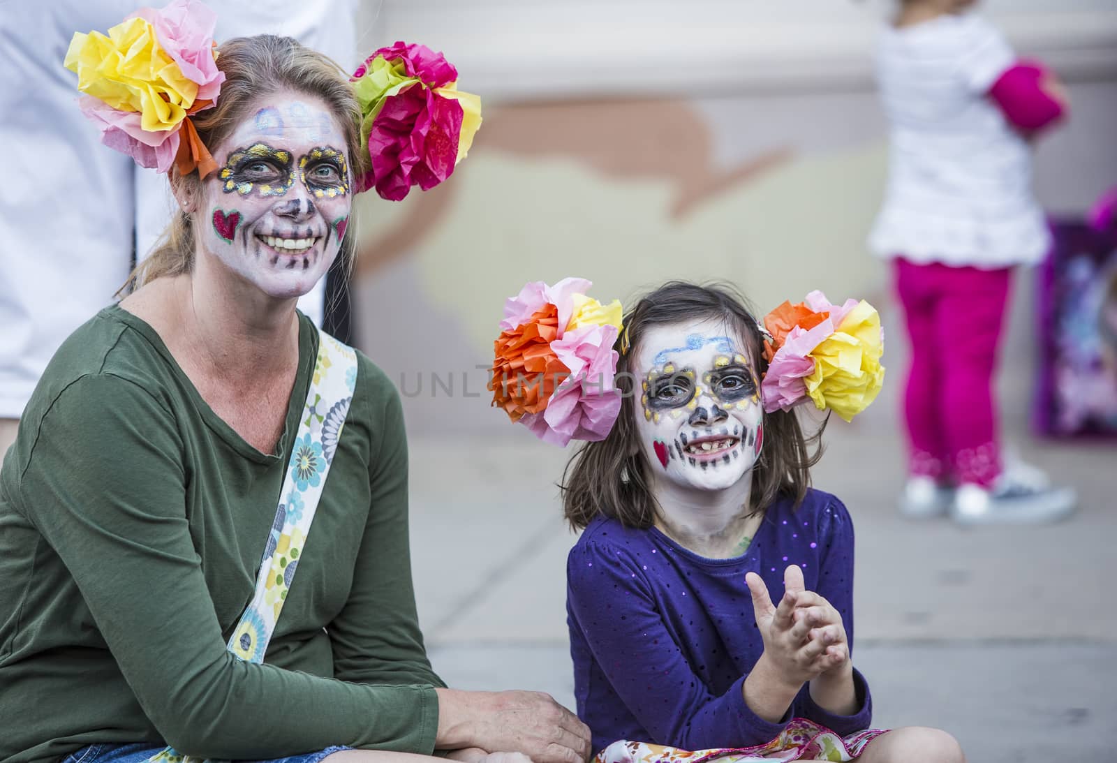 Woman and Girl in Dia De Los Muertos Makeup by Creatista