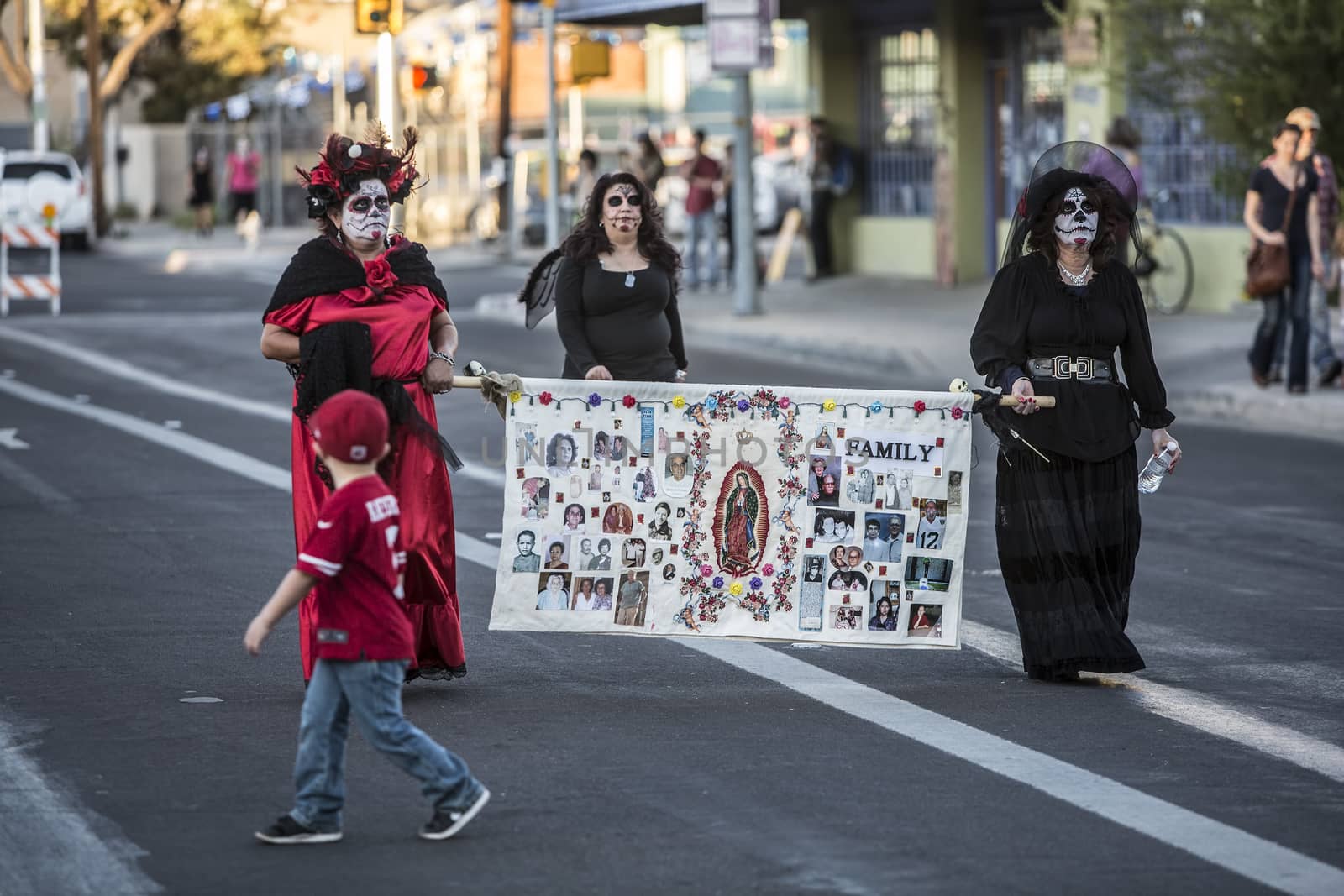 TUCSON, AZ/USA - NOVEMBER 09: Three undientified women walking in the All Souls Procession on November 09, 2014 in Tucson, AZ, USA.