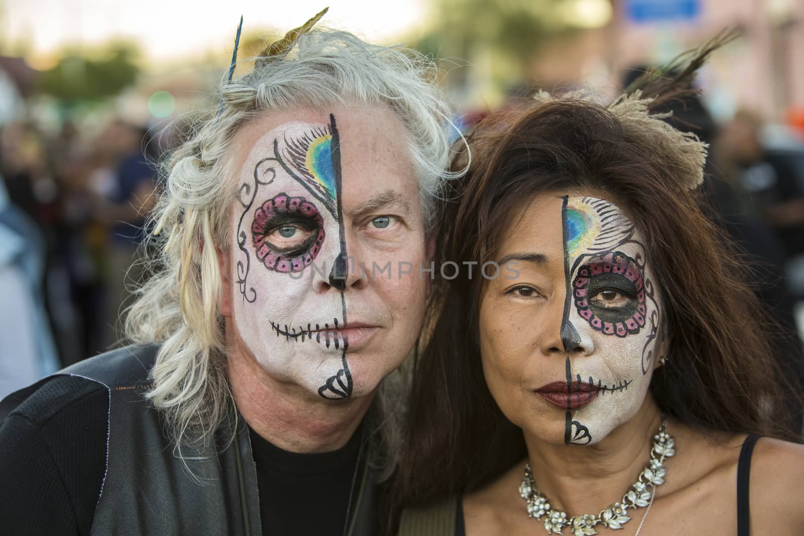 TUCSON, AZ/USA - NOVEMBER 09: Two undientified people in facepaint at the All Souls Procession on November 09, 2014 in Tucson, AZ, USA.