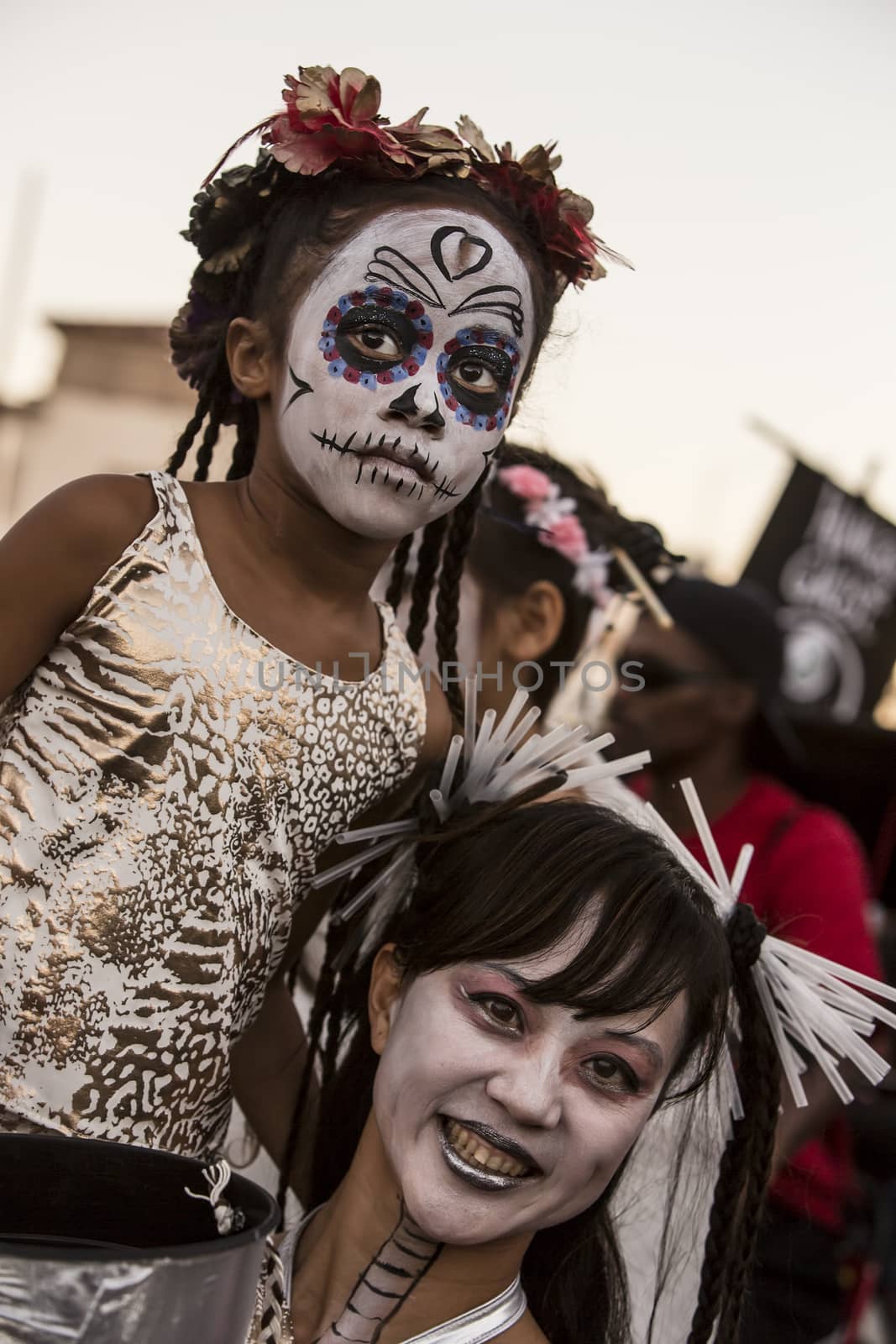 TUCSON, AZ/USA - NOVEMBER 09: Unidentified woman and young girl in facepaint at the All Souls Procession on November 09, 2014 in Tucson, AZ, USA.