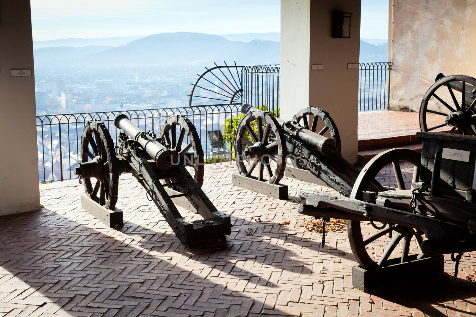 Graz, Austria - January 16, 2011: Old cannon on gun carriage aims to Graz, Austria