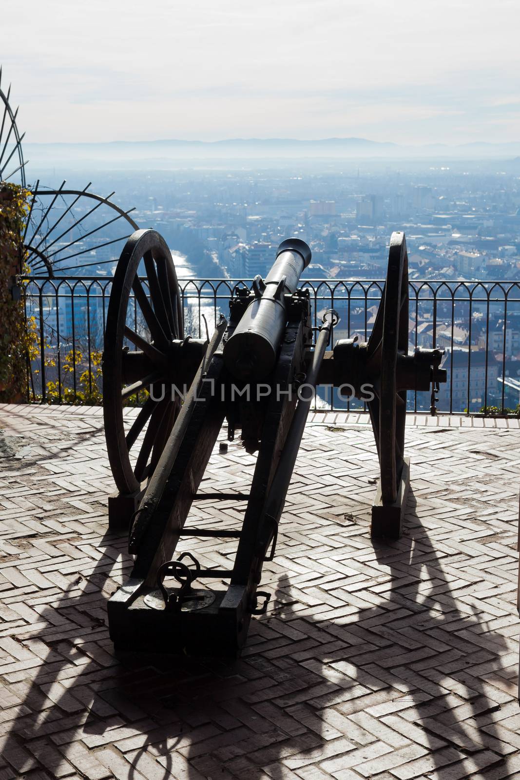 Graz, Austria - January 16, 2011: Old cannon on gun carriage aims to Graz, Austria