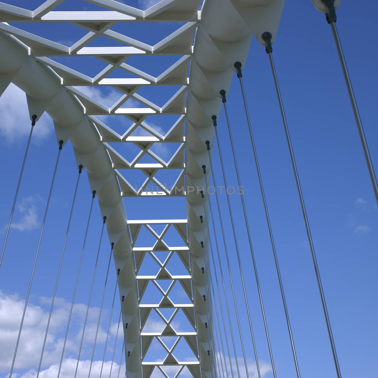White steel curved modern bridge