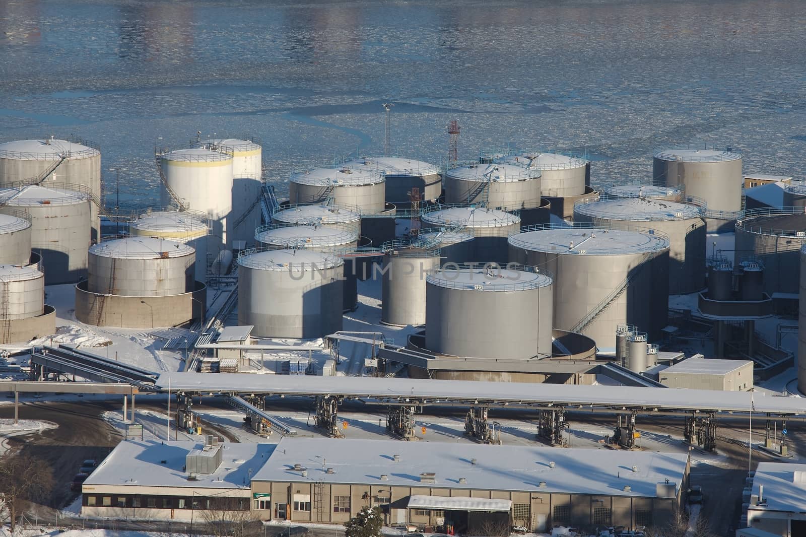 Big oil silos in a dock