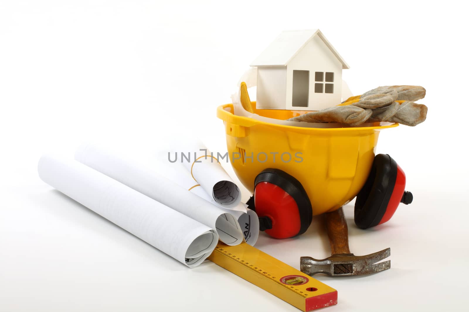 construction concept-  house model,  industrial tools and protective gear 
