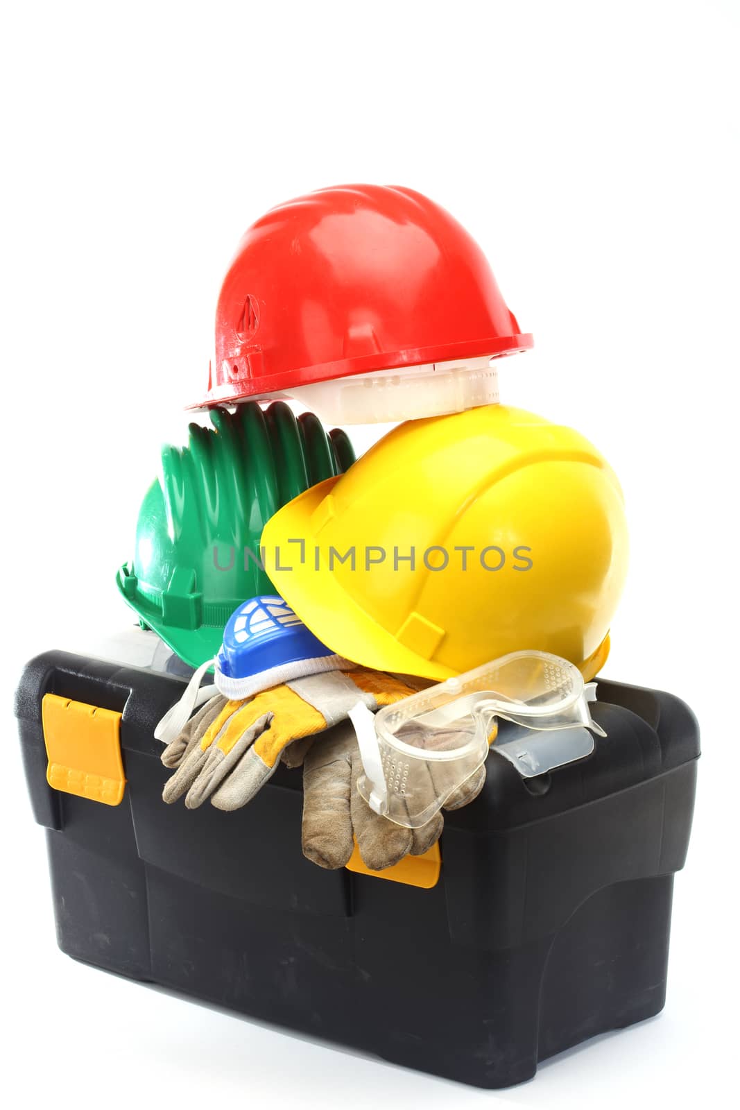 Some color protective helmets and toolbox on white 