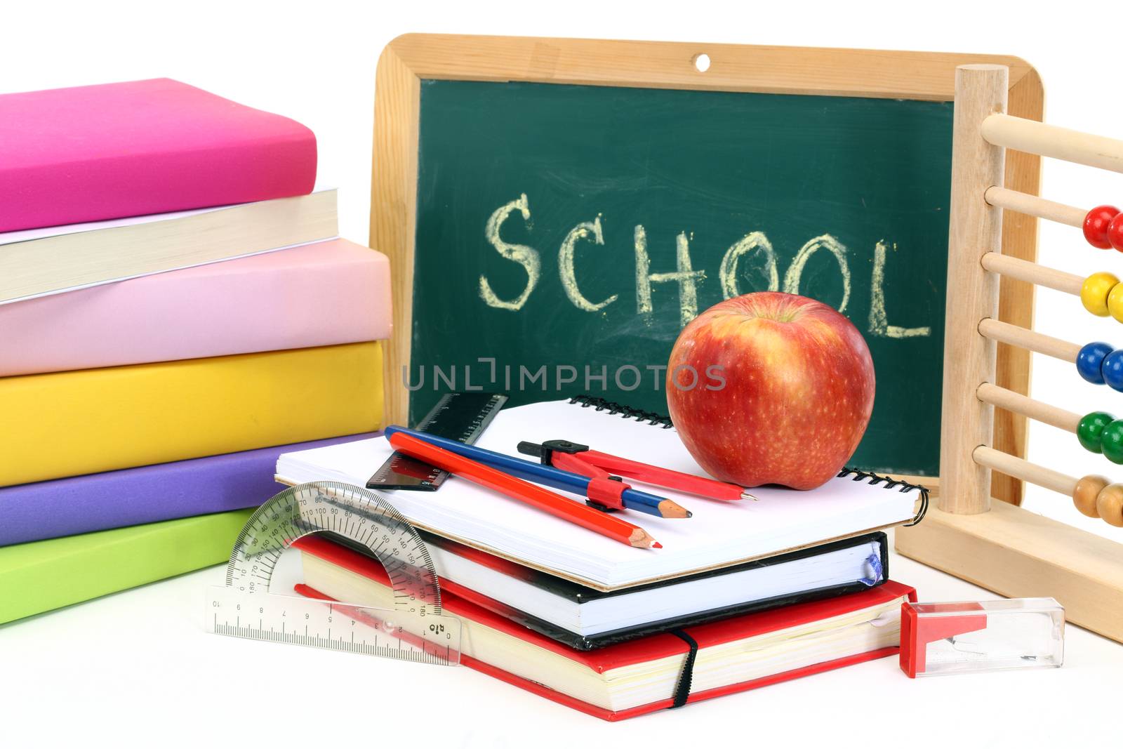 back to school-abacus, notebooks, pencil and apple over chalkboard 