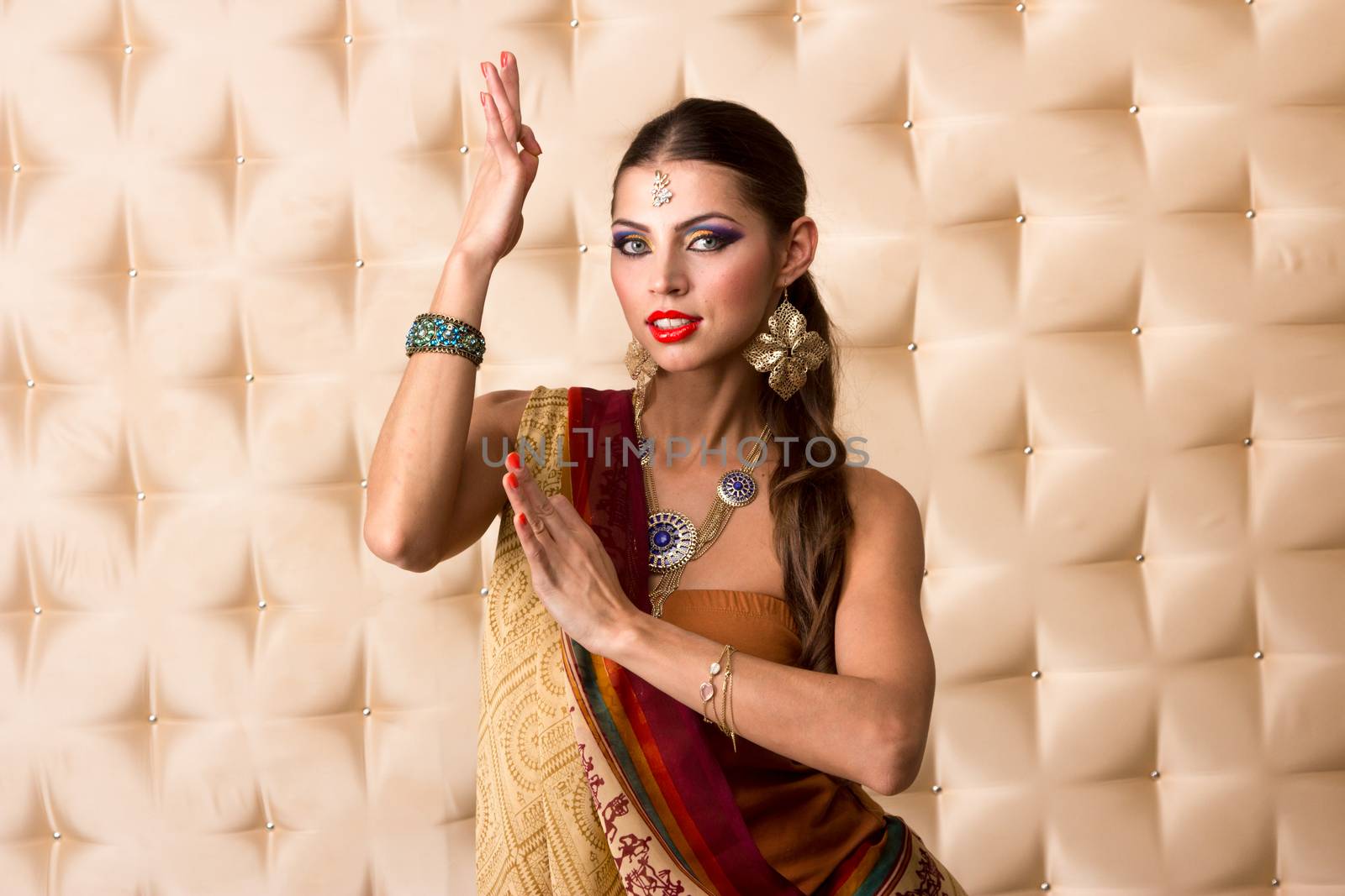 European woman posing in Indian Style, isolated on  white