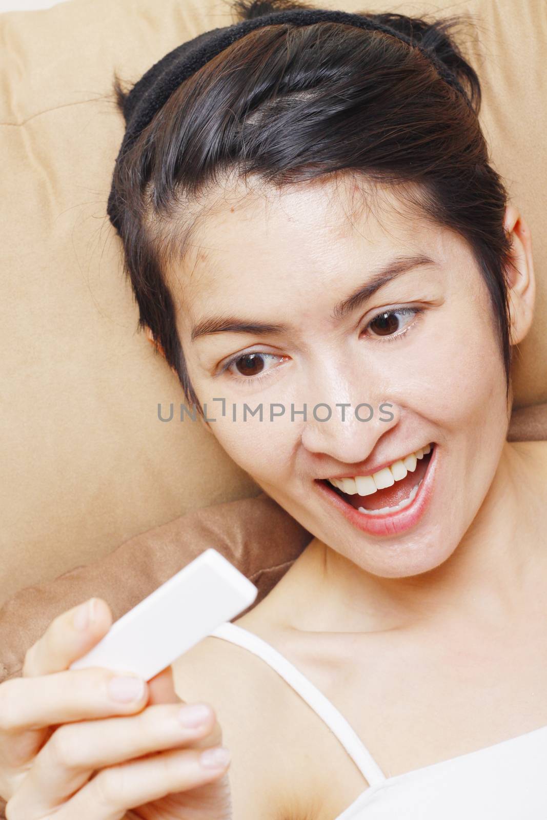 Excited Young Woman Checking Pregnancy Test At Home