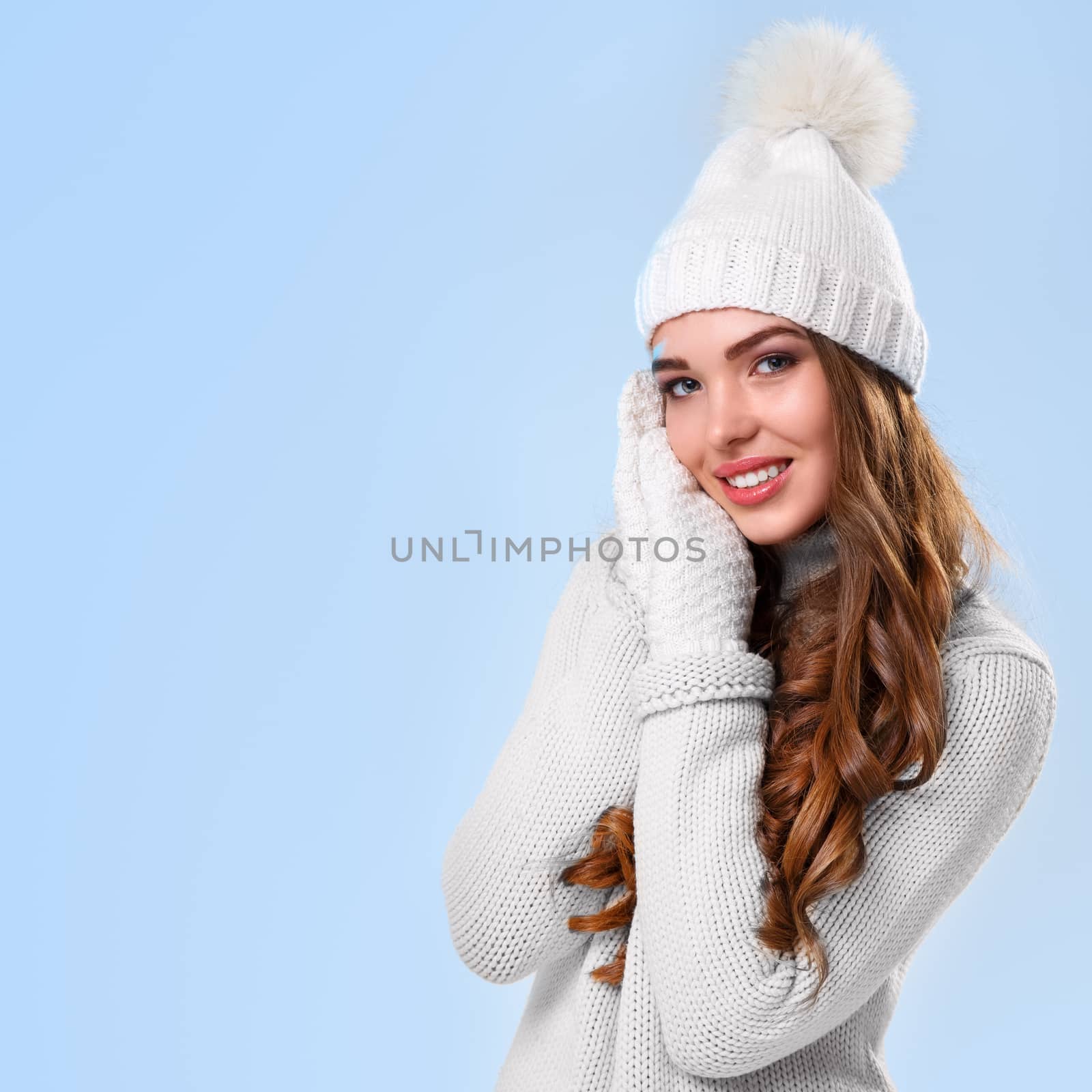 Winter. Cute girl on a blue background