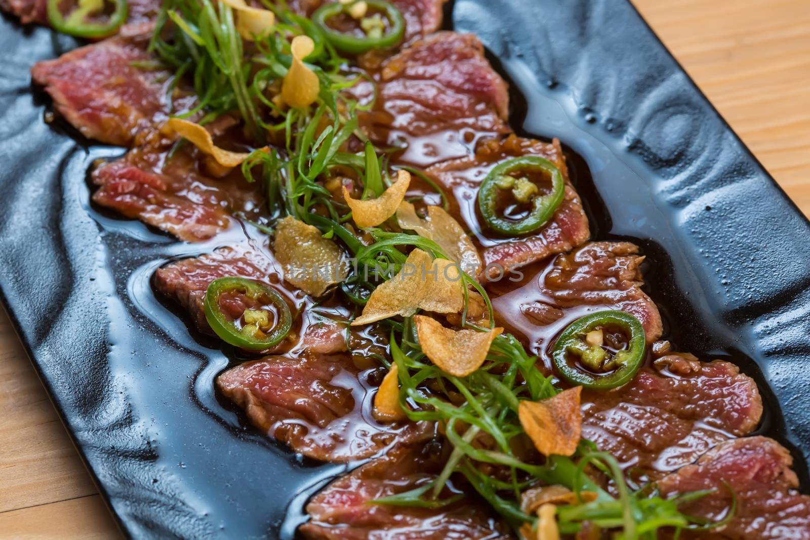 Beef Carpaccio on dark background by sarymsakov