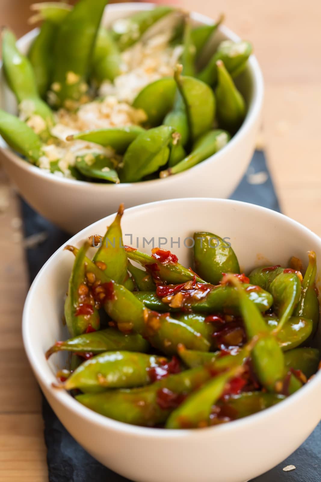 Green string beans chinese dish with spices. Selective focus