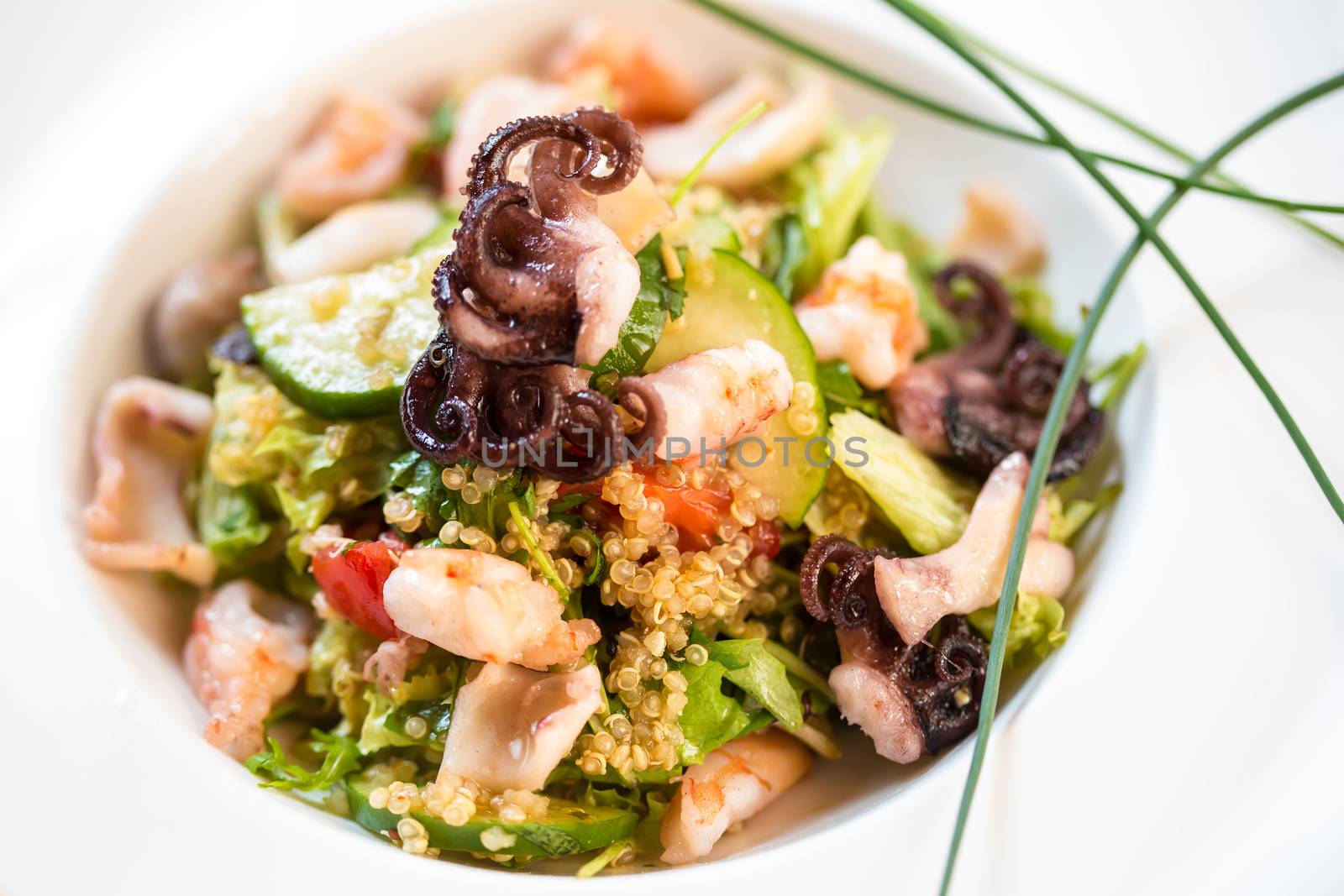organic seafood salad with quinoa. selective focus