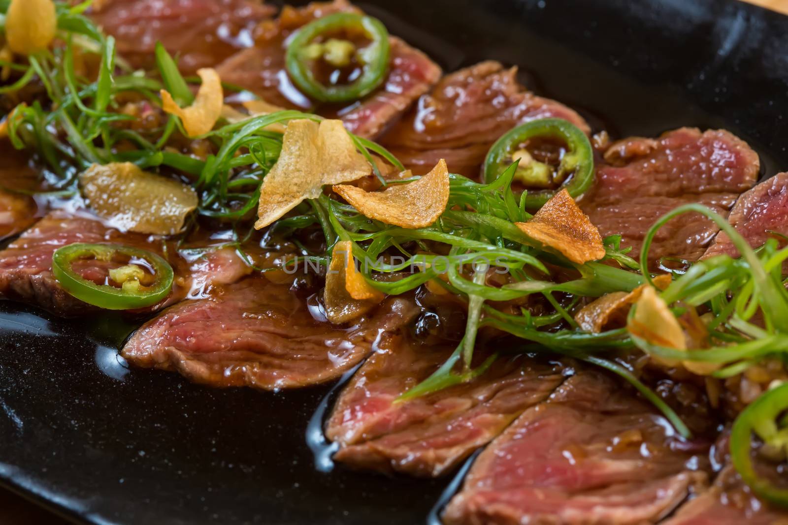 Beef Carpaccio on dark background. selective focus